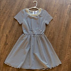 Francesca’s alya dress in navy and white stripes.